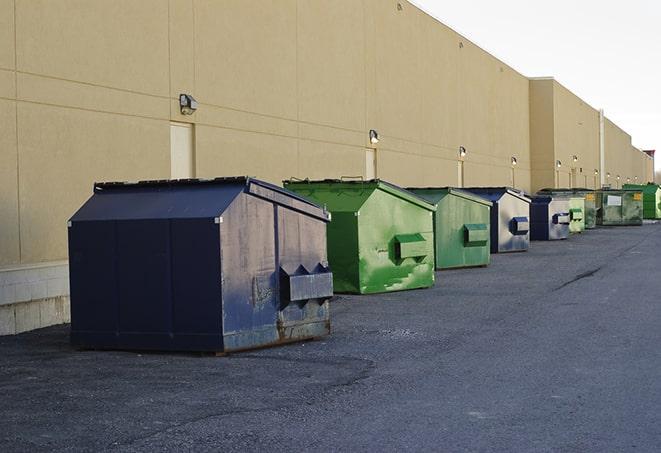 several large trash cans setup for proper construction site cleanup in Livonia